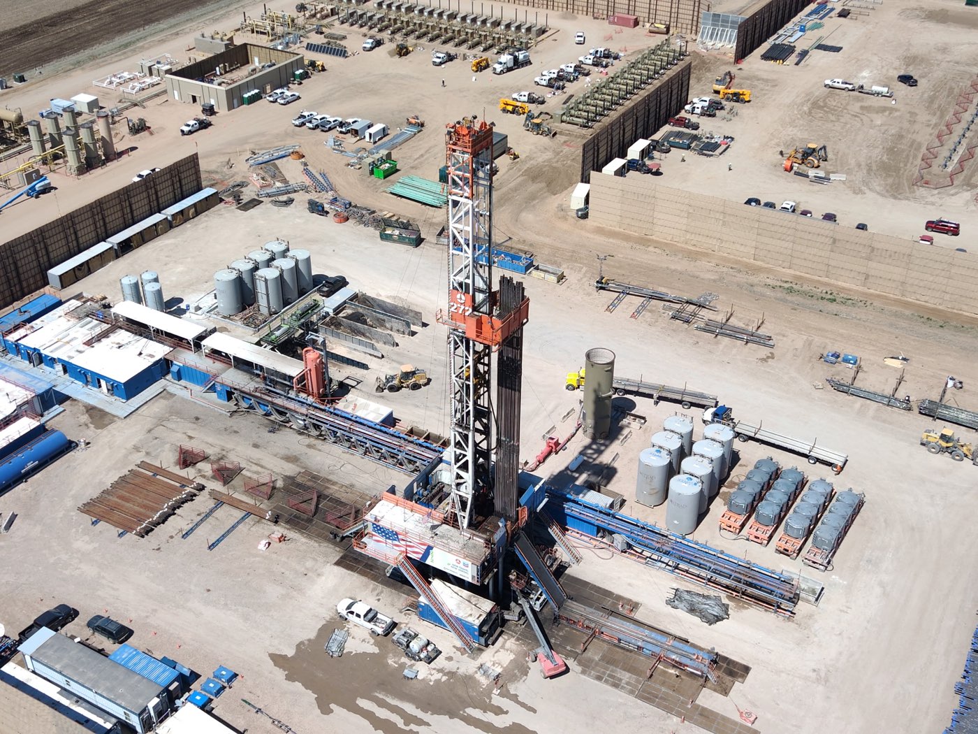 Aerial view of a drilling rig flying the American flag