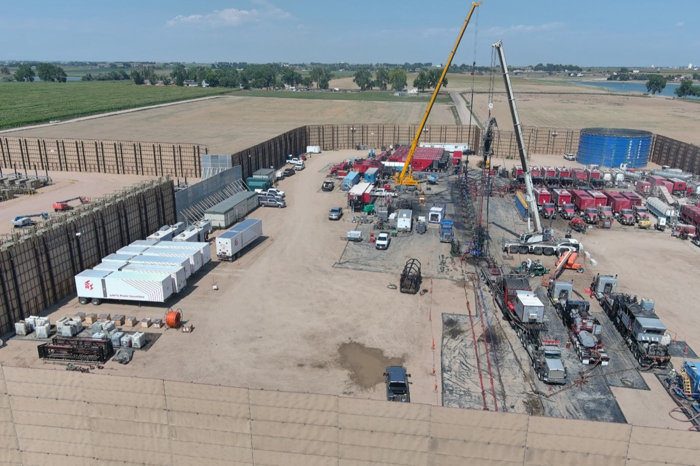 Cranes and completions equipment on location